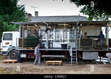 Wine bottling at the vineyard at Chateau Fontcaille Bellevue in the Bordeaux region of France Stock Photo