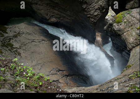 The largest subterranean waterfalls in Europe, the Trummelbach Falls funnel water from the melting glaciers of the Swiss Alps. Stock Photo