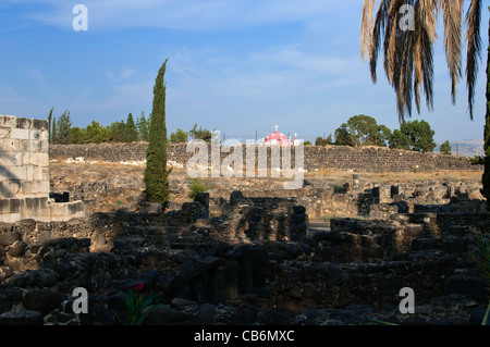 Capernaum ruins with view Greek Orthodox Church in the distance,Galilee, Israel,Asia, Middle East Stock Photo