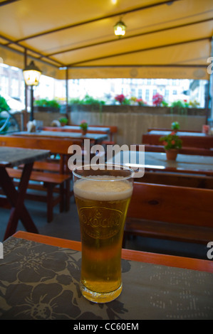 Half litre of Okocim Polish beer along ulica Piwna street Gdansk Pomerania northern Poland Europe Stock Photo