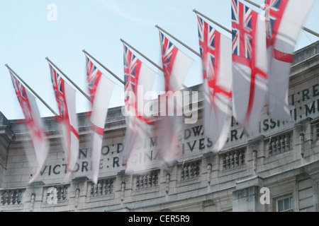 Flags in the breeze at Admiralty Arch near to Buckingham Palace. Stock Photo