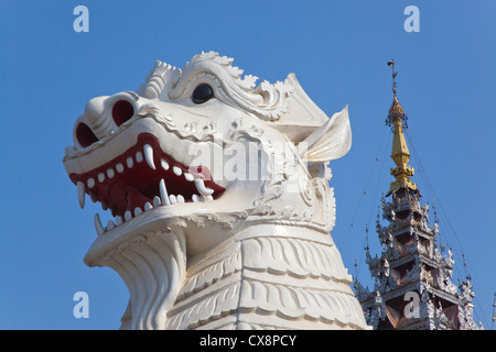 Giant CHINLES (half lion half dragon) guard the southwest entrance to MANDALAY HILL - MANDALAY, MYANMAR Stock Photo