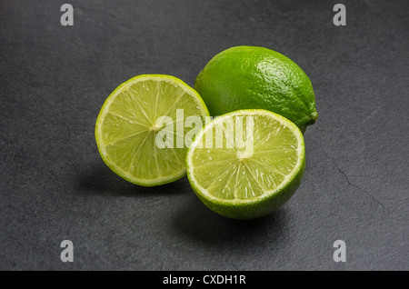 limes on slate plate Stock Photo