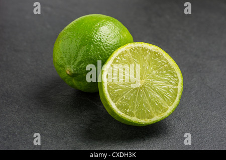 limes on slate plate Stock Photo