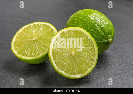 limes on slate plate Stock Photo