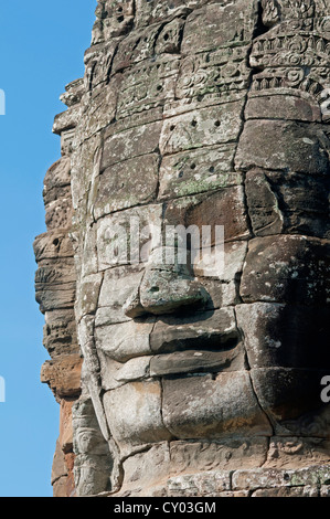 The smile of Angkor, huge face carved in stone on a tower, Bayon Temple, Angkor Thom, Siem Reap, Cambodia, Asia Stock Photo