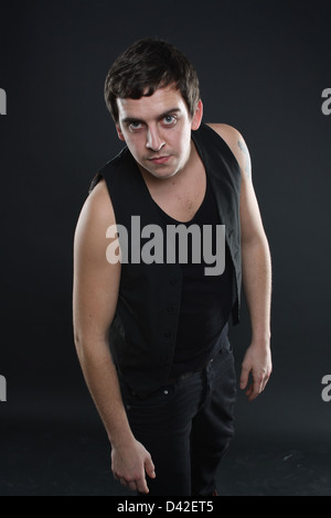 Man leaning forward towards the camera. Stock Photo