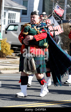 South Amboy, NJ, USA. 9th March, 2013. Bagpipe player marching in St. Patrick's Day Parade in South Amboy, NJ Stock Photo