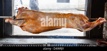 Carcass of a lamb being fried on a spit Stock Photo