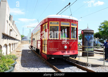 The red streetcars, also named Ladies in red, drives along the Riverfront of the French Market on the Public Belt Railroad Corridor for a length of 2,5 km.  Photo: Klaus Nowottnick Date: April 22, 2013 Stock Photo