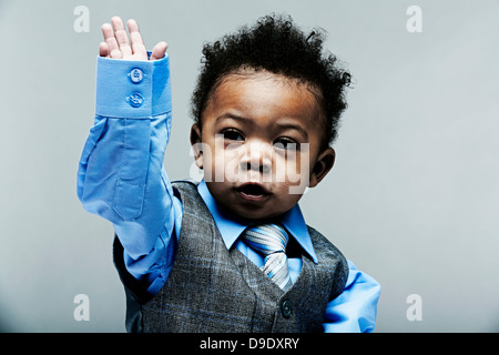 Portrait of baby boy wearing waistcoat, shirt and tie Stock Photo