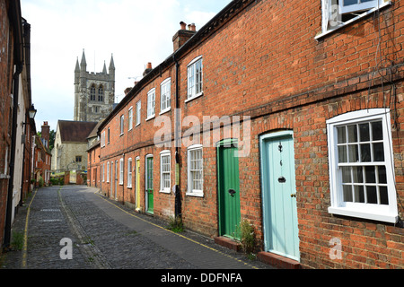 Terraced houses and Parish Church of St Andrews, Lower Church Lane, Farnham, Surrey, England, United Kingdom Stock Photo