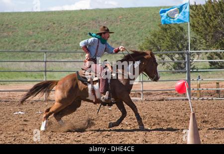 Cowboy on horse, mounted shooting competition, End of Trail Wild West Jubilee, near Albuquerque, New Mexico USA Stock Photo