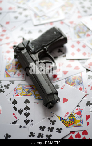 gun and playing cards Stock Photo