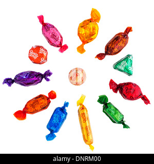 A selection of Nestle Quality Street chocolates sweets showing each individual sweet on a white background Stock Photo