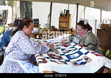 DEARBORN, MI - MAY 26: Civil-war era re-enactors quilting during the Civil War remembrance at Greenfield Village May 26, 2013. Stock Photo