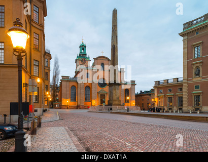 Looking up Slottsbacken towards Stockholm Cathedral and the granite obelisk, Stockholm, Sweden.  The Royal Palace is to right. Stock Photo