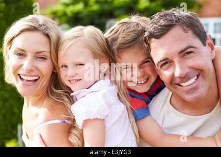 Portrait Of Happy Family In Garden Stock Photo