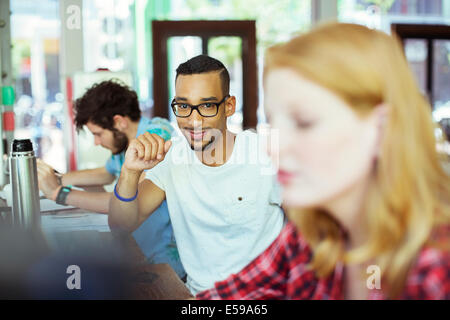 Man working in cafe Stock Photo