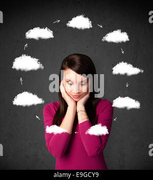 Young woman thinking with cloud circulation around her head Stock Photo