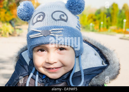 Cute little  child boy  in autumn park Stock Photo