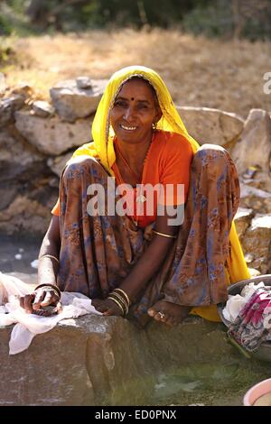 Indian woman washing her clothes India Stock Photo