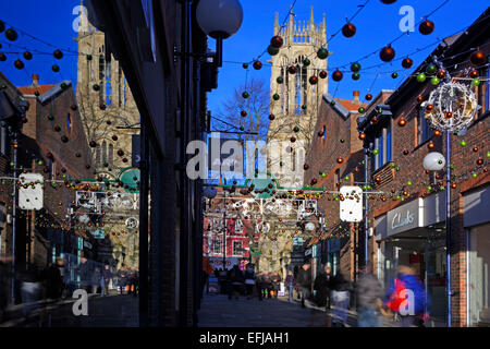 Christmas shoppers in Coppergate, York, North Yorkshire, England, UK Stock Photo