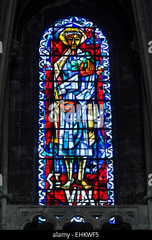 Contemporary stained glass from the 1950s depicting Saint Vincent in the Cathédrale Saint-Vincent, Chalon-sur-Saône, France. Stock Photo