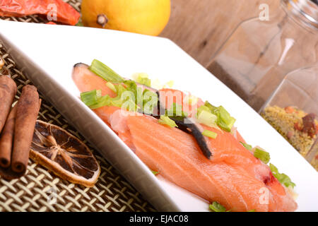 Slice of red fish salmon with fruits Stock Photo