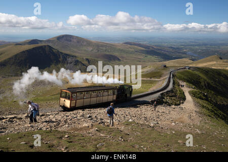 Snowdon Mountain Railway train and the Llanberis path, Snowdon, Snowdonia National Park, Gwynedd, Wales; United Kingdom, Europe Stock Photo