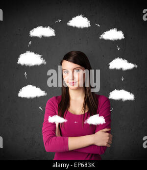 Young woman thinking with cloud circulation around her head Stock Photo