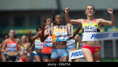 Eugene, USA. 30th May, 2015. Jennifer Simpson (1st R) of the United States crosses the finishing line during the women's 1500m event at the 2015 IAAF Diamond League in Eugene, the United States, on May 30, 2015. Jennifer Simpson claimed the champion with 4:00:98. © Yang Lei/Xinhua/Alamy Live News Stock Photo