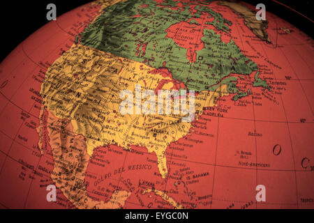 red light world globe illuminated from within with closeup on North America Stock Photo