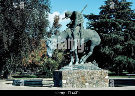 A bronze replica of the famous “End of the Trail” statue by American sculptor James Earle Fraser has been on display since 1968 in Moody Grove Park in Visalia, California, USA. It replaced the original plaster model that was obtained by the city of Visalia for outdoor display after being exhibited at the 1915 Panama-Pacific International Exposition in San Francisco. The Indian on horseback had deteriorated after 48 years in the park but was obtained by the National Cowboy & Western Heritage Museum in exchange for this life-size bronze casting. Stock Photo