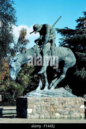 A bronze replica of the famous “End of the Trail” statue by American sculptor James Earle Fraser has been on display since 1968 in Moody Grove Park in Visalia, California, USA. It replaced the original plaster model that was obtained by the city of Visalia for outdoor display after being exhibited at the 1915 Panama-Pacific International Exposition in San Francisco. The Indian on horseback had deteriorated after 48 years in the park but was obtained by the National Cowboy & Western Heritage Museum in exchange for this life-size bronze casting. Stock Photo