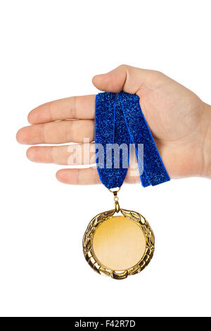 Gold medal in hand Stock Photo