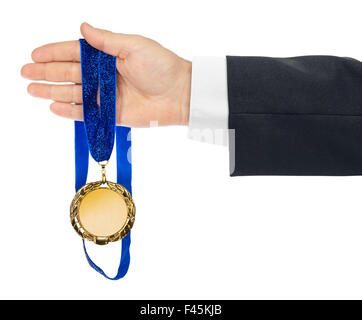 Gold medal in hand Stock Photo