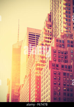 Vintage toned photo of skyscrapers in Manhattan at sunset, New York City, USA. Stock Photo