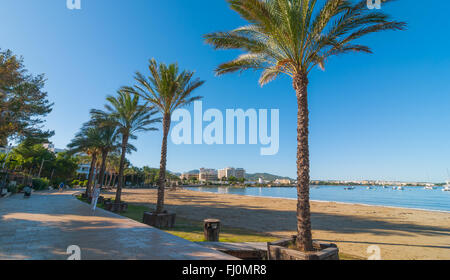 Mid morning sun on Ibiza waterfront.  Warm sunny day along the beach in St Antoni de Portmany Balearic Islands, Spain. Stock Photo