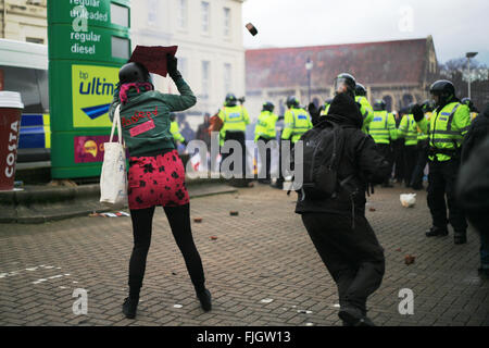 Dover, UK. 30th January, 2016. Anti fascist demonstrator avoids a brick thrown by far right demonstrators. Stock Photo