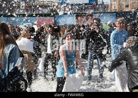 Copenhagen, Denmark, 2nd April, 2016. Massive pillow fights in the City Hall Square in Copenhagen on the 7th International Pillow Fight Day attract many hundreds of participants and spectators of all ages on this sunny Saturday afternoon. More than 100 cities around the world take part in this spectacular and funny annual event. Behind the idea is the Urban Playground Movement, a playful part of the larger public space movement. Credit:  Niels Quist/Alamy Live News Stock Photo