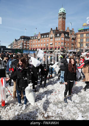 Copenhagen, Denmark, 2nd April, 2016. Massive pillow fights in the City Hall Square in Copenhagen on the 7th International Pillow Fight Day attract many hundreds of participants and spectators of all ages on this sunny Saturday afternoon. More than 100 cities around the world take part in this spectacular and funny annual event. Behind the idea is the Urban Playground Movement, a playful part of the larger public space movement. Credit:  Niels Quist/Alamy Live News Stock Photo