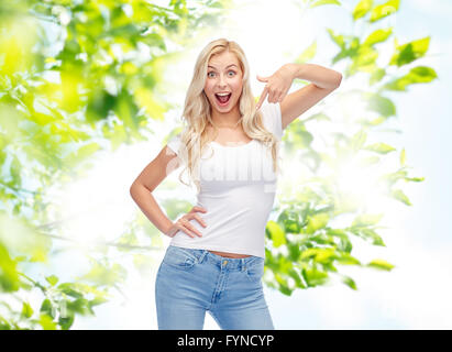 happy young woman or teenage girl in white t-shirt Stock Photo