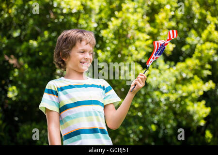 A little boy is holding an american flag Stock Photo