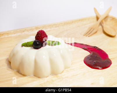 Panna cotta with mixed berry sauce Stock Photo