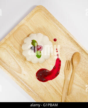 Panna cotta with mixed berry sauce Stock Photo