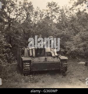 Waffen SS men on Panzer Assault Gun Sturmgeschütz LAH  France 1944 Stock Photo