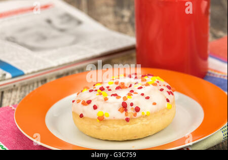 Fresh frosted donut snack with a hot drink Stock Photo