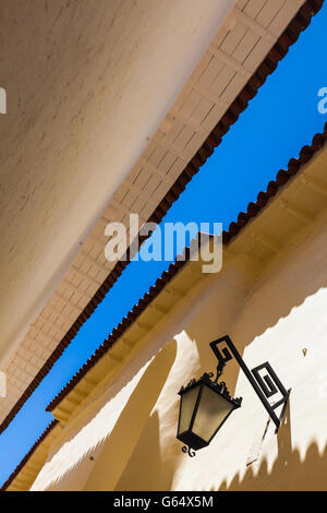 Abstract image of tiled eaves and vivid blue sky in Cusco, Peru Stock Photo