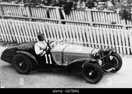 Italian driver Tazio Nuvolari driving an Alfa Romeo Alfa Romeo 8C in the 24-hour Le Mans race, in which he claimed first place with fellow driver Raymond Sommer (not pictured). Stock Photo